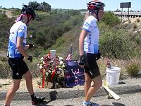 SH-ride 08  Riders  pay their respect by placing flowers on Memorial.